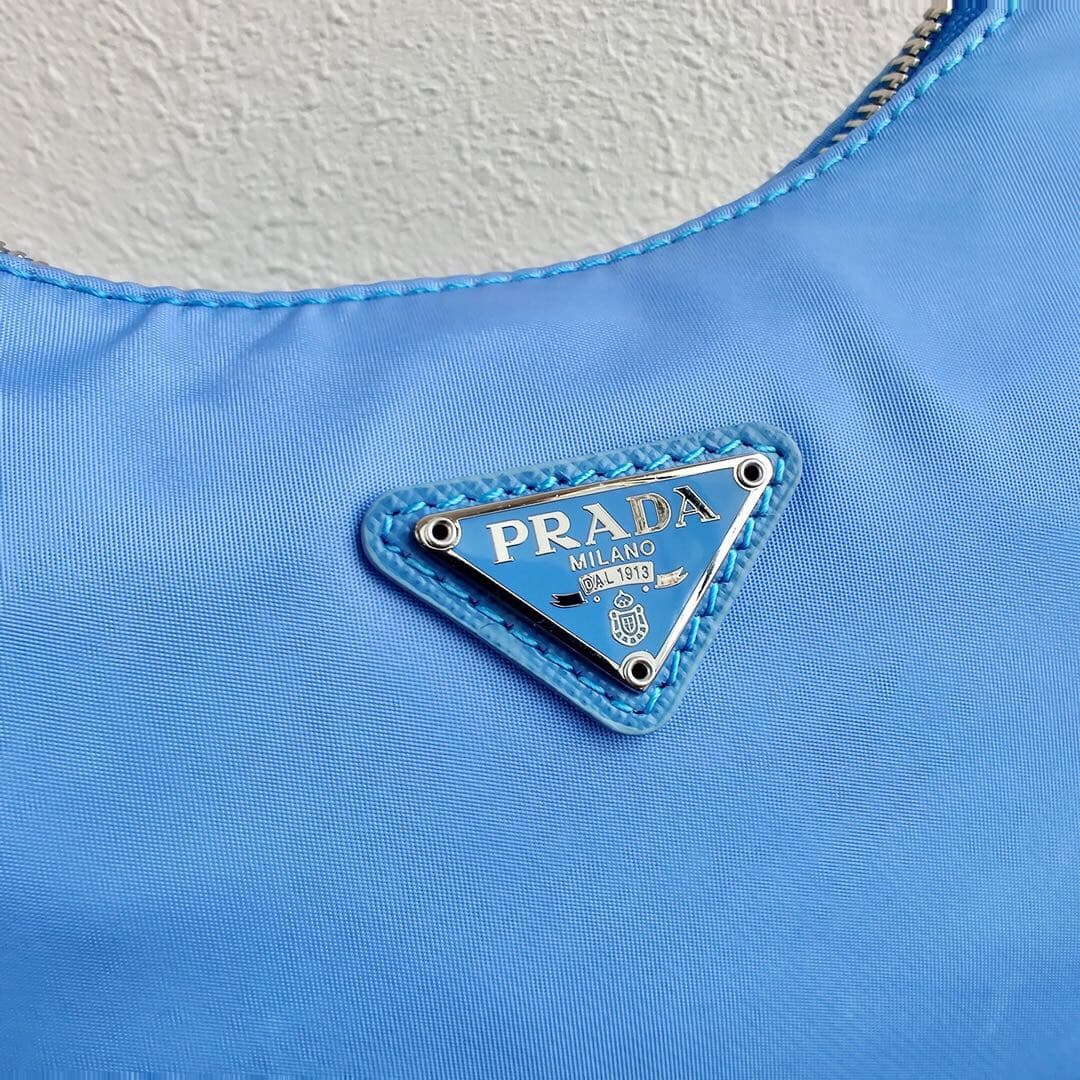 Prada Re-Edition 2005 Re-Nylon and Saffiano mini bag Blue 1N204M