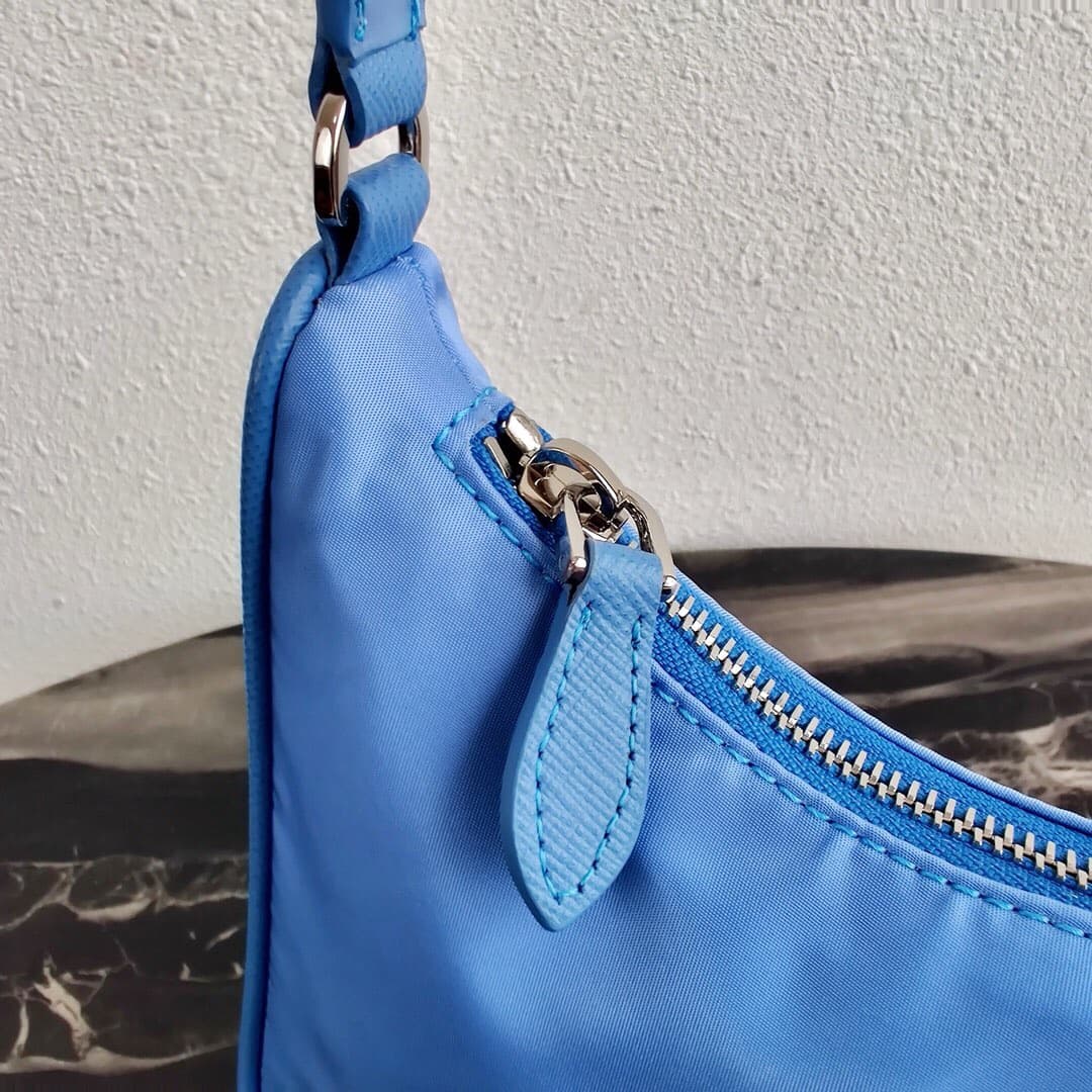 Prada Re-Edition 2005 Re-Nylon and Saffiano mini bag Blue 1N204M