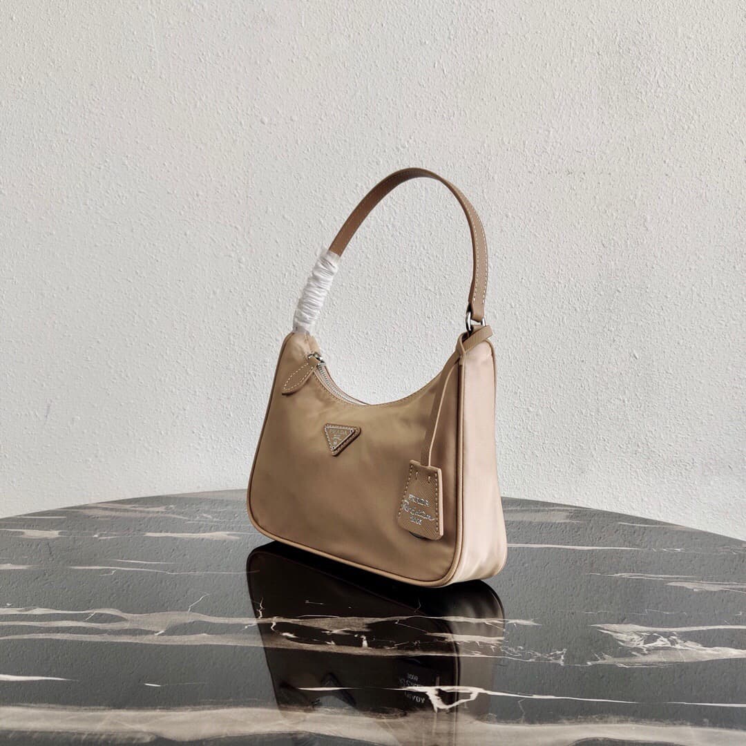 Prada Re-Edition 2005 Re-Nylon and Saffiano mini bag Beige 1N204M