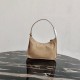 Prada Re-Edition 2005 Re-Nylon and Saffiano mini bag Beige 1N204M