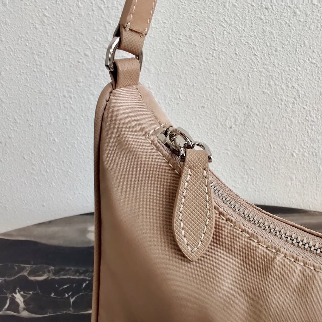 Prada Re-Edition 2005 Re-Nylon and Saffiano mini bag Beige 1N204M