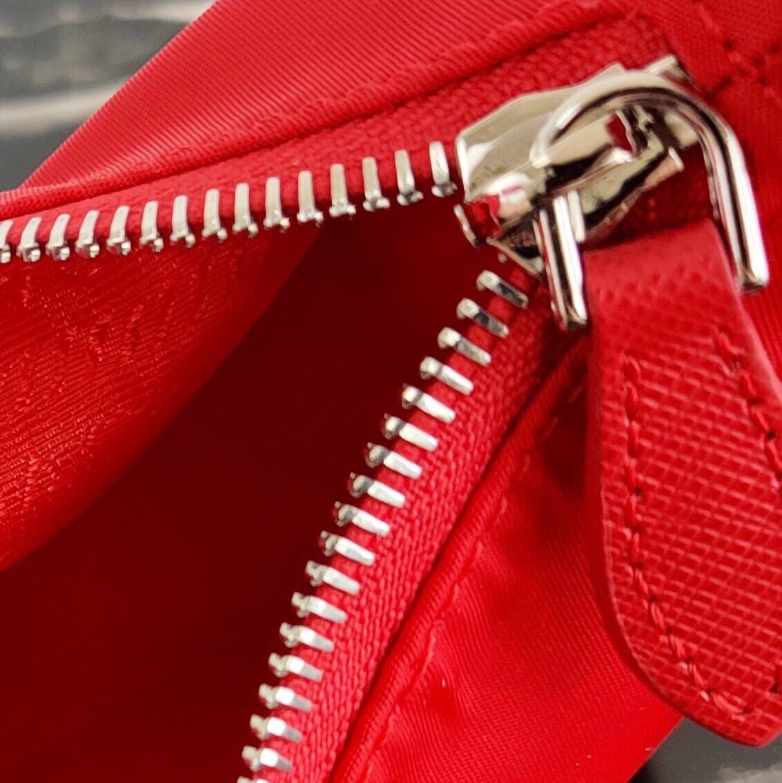 Prada Re-Edition 2005 Re-Nylon and Saffiano mini bag Red 1N204M