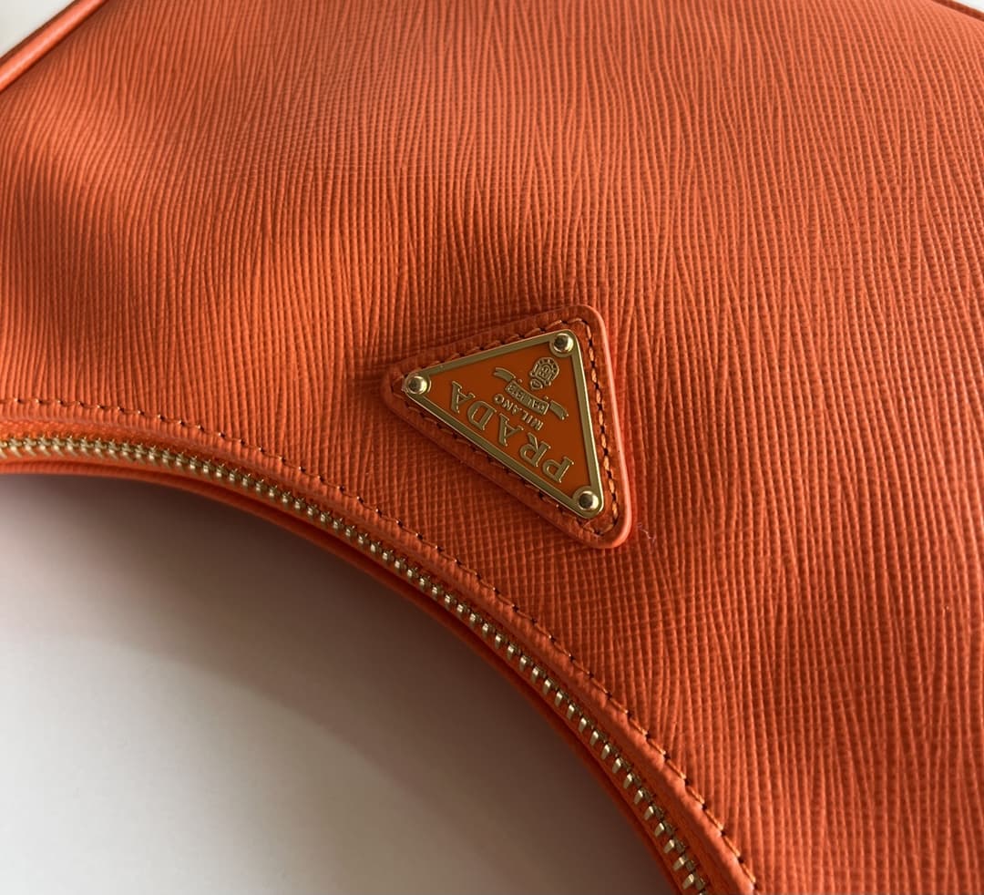 Prada Re-Edition Saffiano leather mini bag Orange 1BC204